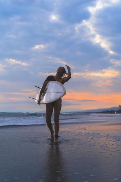 Woman Surfer with Surfboard at Sunset Over the Ocean – Free Stock Photo, Download Free