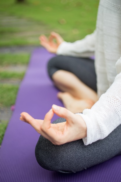 Young Woman Meditating on a Mat – Free Stock Photo for Download