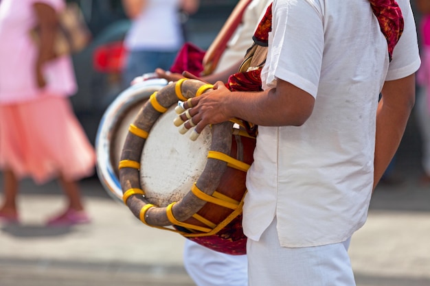 Musician Playing Thavil in Tamil Procession – Free Download