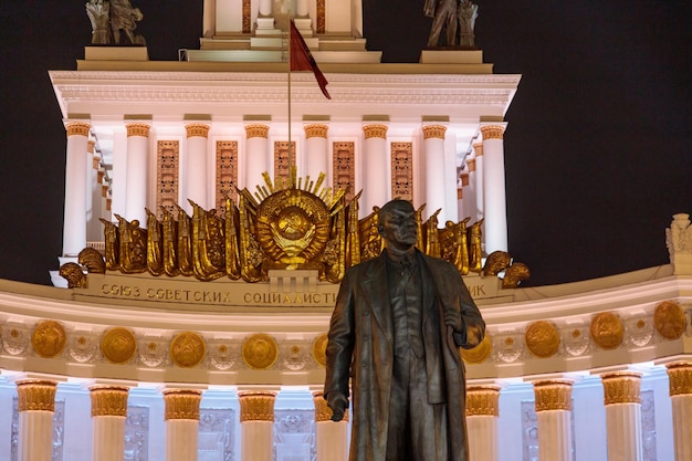 A Statue of a Man in Front of a Building with a Flag – Free Stock Photo, Download Free