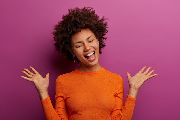 Emotional Dark Skinned Woman Gesturing with Raised Palms – Free Stock Photo for Download