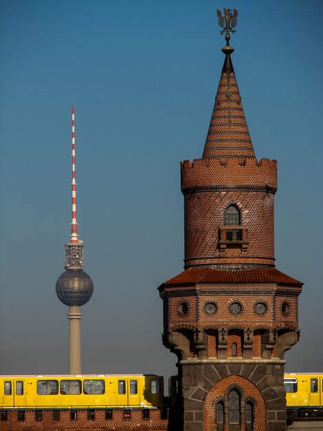 Clock Tower by Fernsehturm with Stunning Sky Background – Free Download