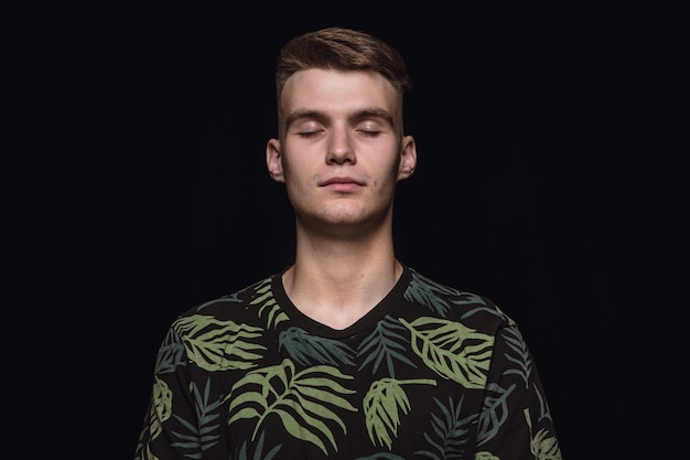 Close Up Portrait of a Young Man in a Black Studio – Free Stock Photo Download