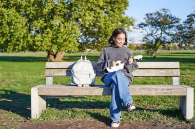 Carefree Girl Playing Ukulele on a Sunny Day in the Park – Free Stock Photo, Download for Free