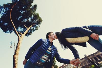 Romantic Moment: Man Kisses Woman on the Nose at the Coliseum – Free Download