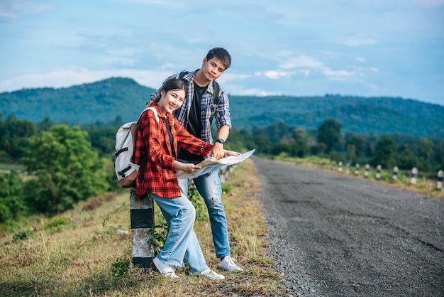 Tourists Checking Roadside Map – Free Stock Photo Download