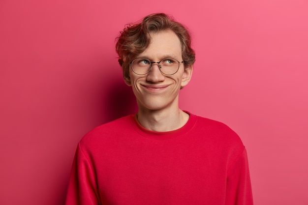 Handsome Man with Tender Smile and Round Spectacles on Pink Background – Free Download