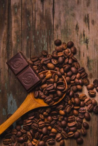 Spoon and Chocolate on Coffee Beans – Free Download