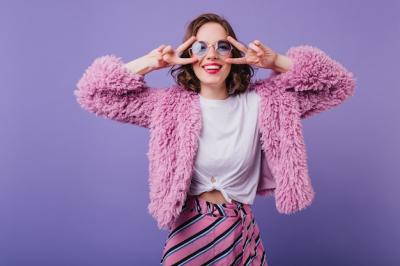 Joyful Young Lady Dancing in a Fluffy Coat – Free Download