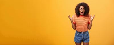 Pissed and Outraged African American Young Female in Stylish Outfit Yelling Against Orange Background – Free Stock Photo, Download for Free