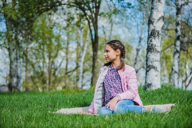 Relaxed Girl Sitting on the Grass – Free Stock Photo for Download