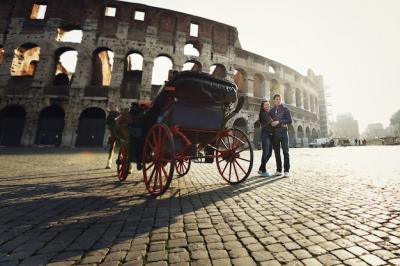 Two People Standing Near the Coliseum in Rome – Free Stock Photo for Download