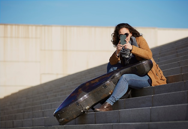 Young Beautiful Woman Taking a Picture with Her Cell Phone – Free Stock Photo, Download Free