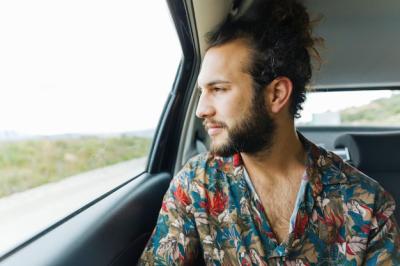 Handsome Man Gazing Out of a Car Window – Free to Download