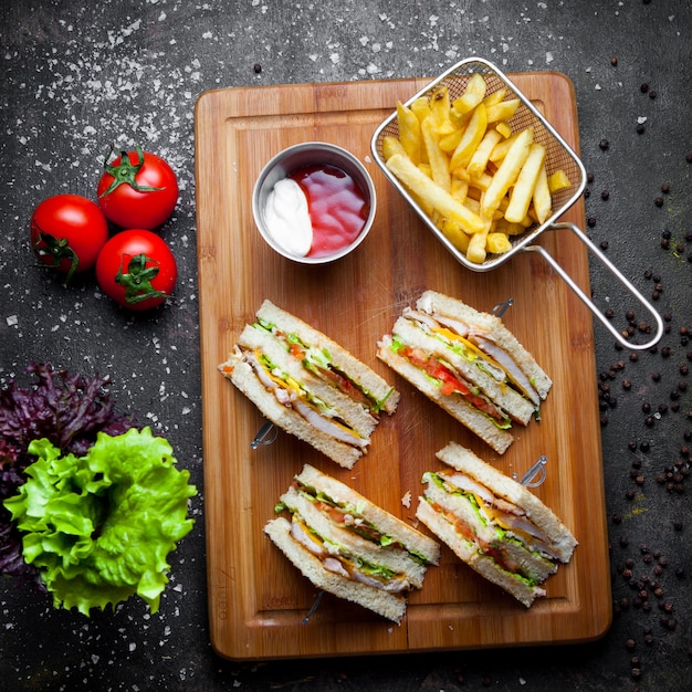 Club Sandwich with Ketchup and Mayonnaise Accompanied by French Fries – Free Download