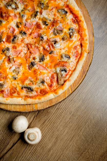 Delicious Pizza with Mushrooms, Ham, and Herbs – Free Download