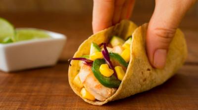 Close-up of a Hand Holding Delicious Mexican Food – Free Download