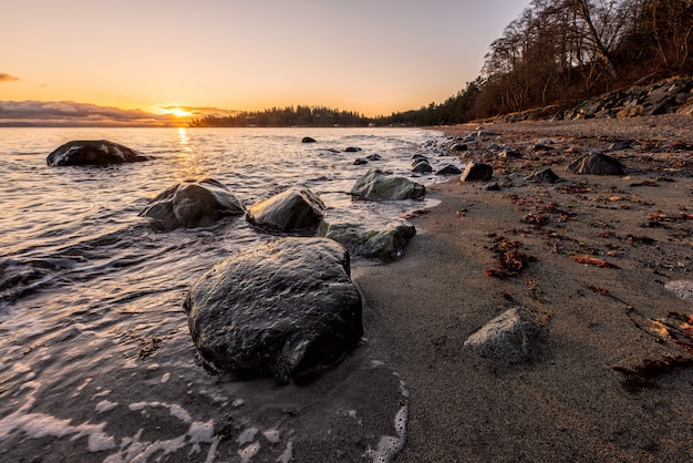 Gray Rocks on Seashore during Sunset – Free Stock Photo for Download