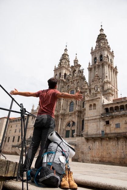 Handsome Male Traveler at a Historical Cathedral – Free Download