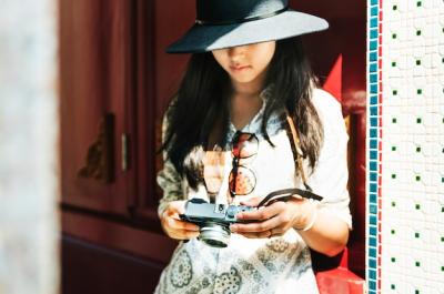 Young Asian Woman with Camera Sightseeing – Free Stock Photo for Download