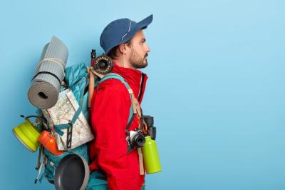 Serious Male Backpacker with Rucksack: Exploring New Surroundings – Free Download