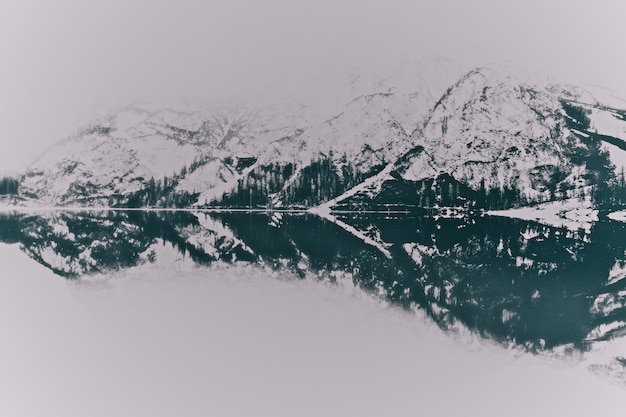 Snowy Mountain Landscapes Near a Tranquil Lake – Free Download