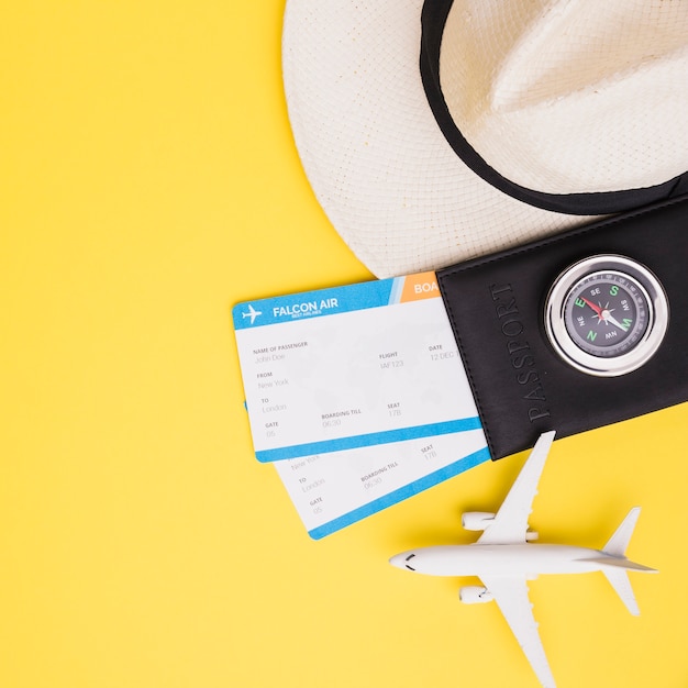 Travel Essentials: Tickets, Passport, Hat, and Plane – Free Download