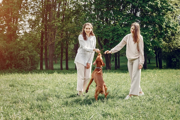 Elegant and Stylish Sisters Enjoying a Spring Park – Free Stock Photo for Download