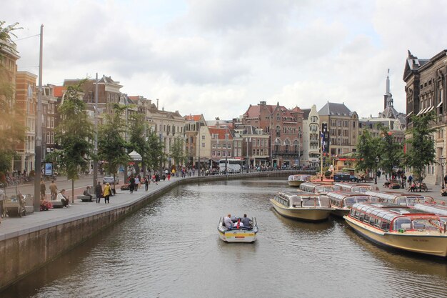 Beautiful Canal Views with Ships in Old Amsterdam – Free Download