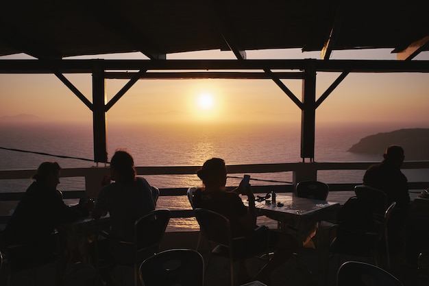 Silhouette of People Enjoying Sunset at Potamos Beach, Greece – Free Stock Photo for Download