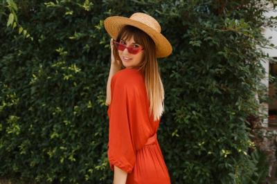 Lovely Smiling Woman in Stylish Red Sunglasses and Orange Dress – Free to Download