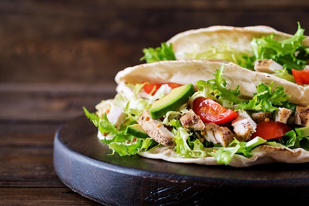 Pita Bread Sandwiches with Grilled Chicken, Avocado, Tomato, Cucumber, and Lettuce – Free Stock Photo for Download