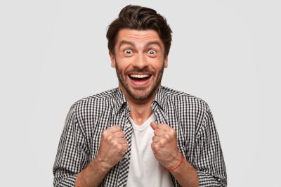Triumphant Young European Man Celebrates Success – Free Stock Photo for Download