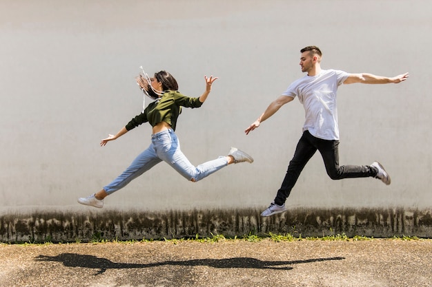 Young Couple Dancing in Front of a Wall – Free Stock Photo, Download for Free