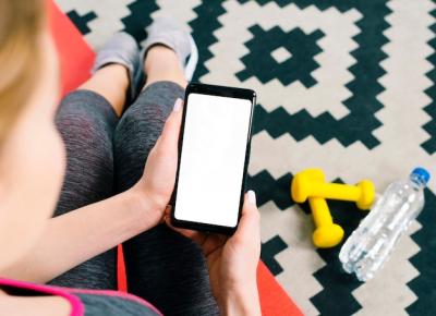 Overhead View of Fit Young Woman with Mobile Phone – Free Download