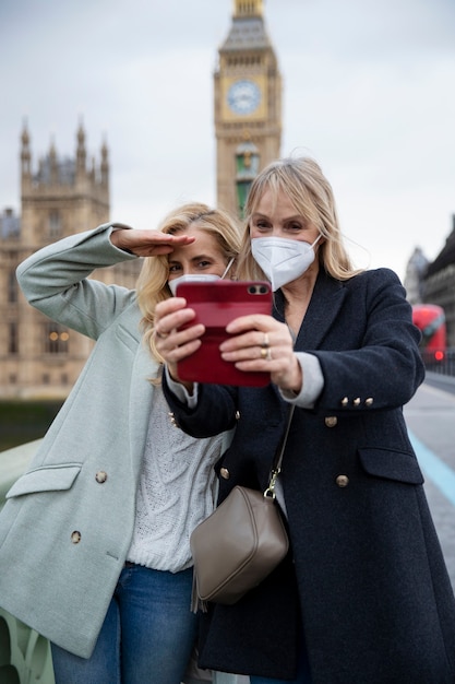 Tourists Exploring the City in Travel Masks – Free Download