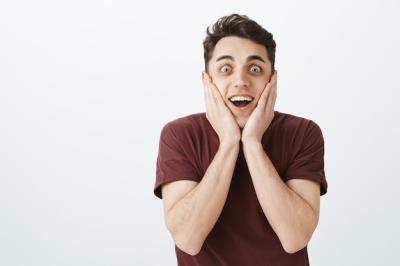 Happy Excited Guy in Red T-Shirt Surprised by Exciting Things – Free Stock Photo for Free Download