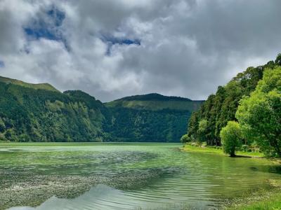 A Seascape View Featuring Lush Green Hills and Crystal Clear Waters – Free Download