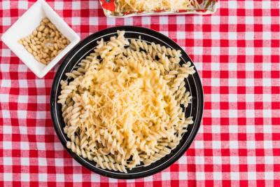 Cheese on Fresh Pasta with Nuts – Free Stock Photo for Download