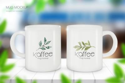 Photorealistic Mug Mockup of Two Cups in a Blurred Cafe – Free Download