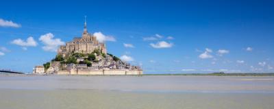 Stunning Panoramic View of Mont-Saint-Michel Under a Blue Sky – Free Stock Photo for Download