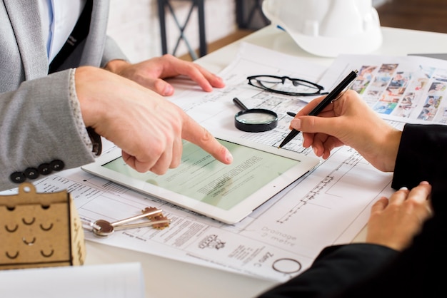 Businessmen Analyzing a Business Plan on a Tablet – Free Stock Photo, Download Free