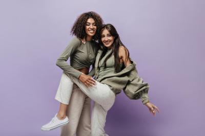 Two Friends with Brunette Hair in Stylish Shirts and Beige Trousers – Free Stock Photo, Download for Free