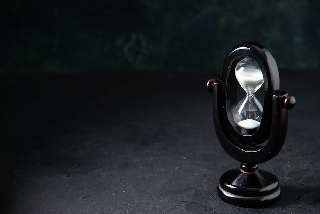 Black Hourglass on Dark Surface – Free Stock Photo, Download for Free