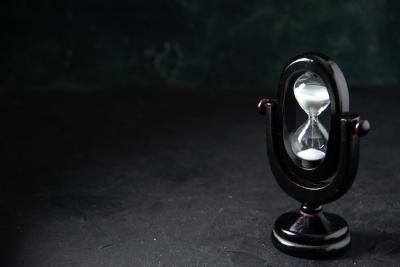 Black Hourglass on Dark Surface – Free Stock Photo, Download for Free