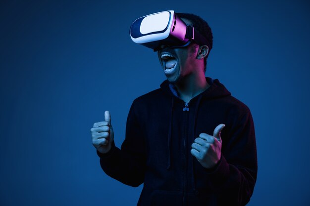 Young Man Playing in VR Glasses with Neon Lights | Free Stock Photo – Download for Free