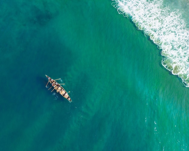 People Fishing in a Boat at Varkala Beach – Free Download