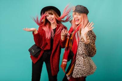 Two Beautiful Women in Stylish Faux Fur Coats and Wool Scarf on Turquoise Wall – Free to Download