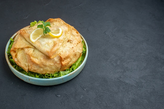 Delicious Cooked Pita with Greens and Lemon on Dark Surface – Free Stock Photo for Download