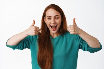 Happy Laughing Redhead Girl Giving Thumbs Up – Free Stock Photo for Download